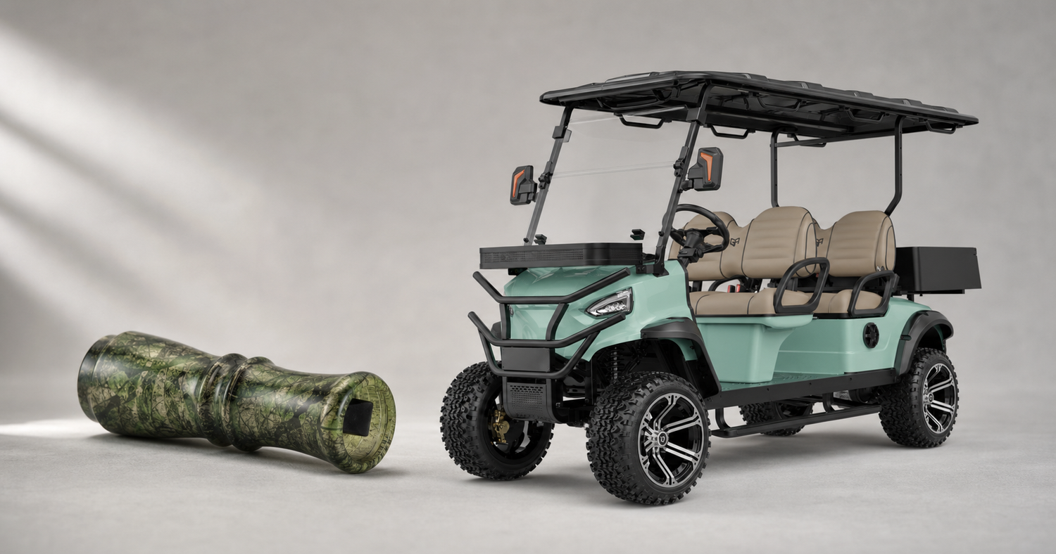 Handcrafted double-reed hunting game call with green camo finish next to a modern lithium electric golf cart in a light studio, illustrating this week's new brands at Lotz Outdoors.