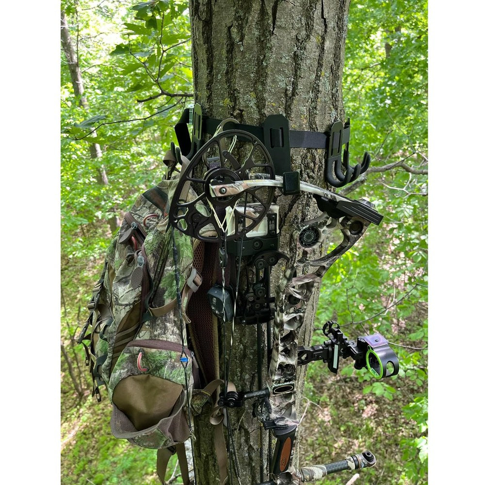 Three-arm tree hanger mounted beside a tree stand