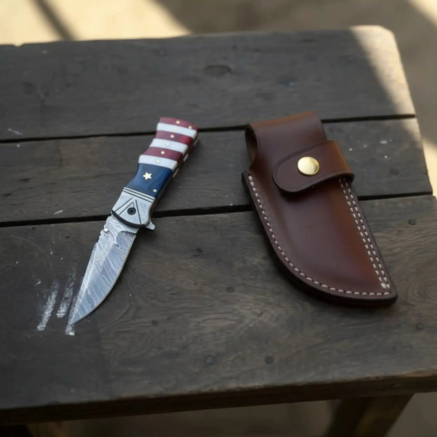 Damascus Folding Pocket Knife — American Flag Handle, Damascus Bolster, Linear Lock &amp; Hand Engraved Leather Sheath