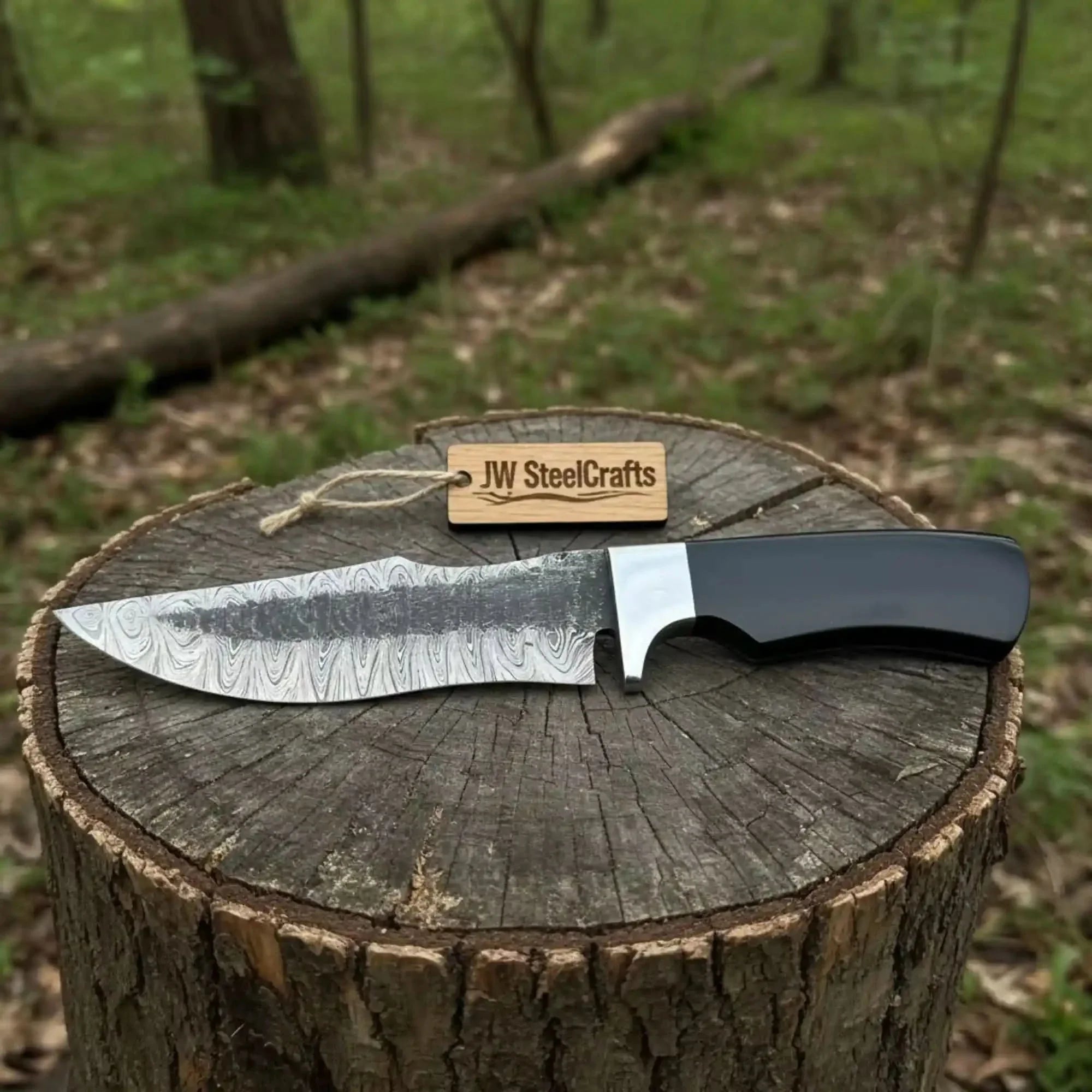 Damascus Trailing Point Fixed Blade Hunting Knife — Forged Ladder Pattern Blade, Black Resin Handle &amp; Steel Guard