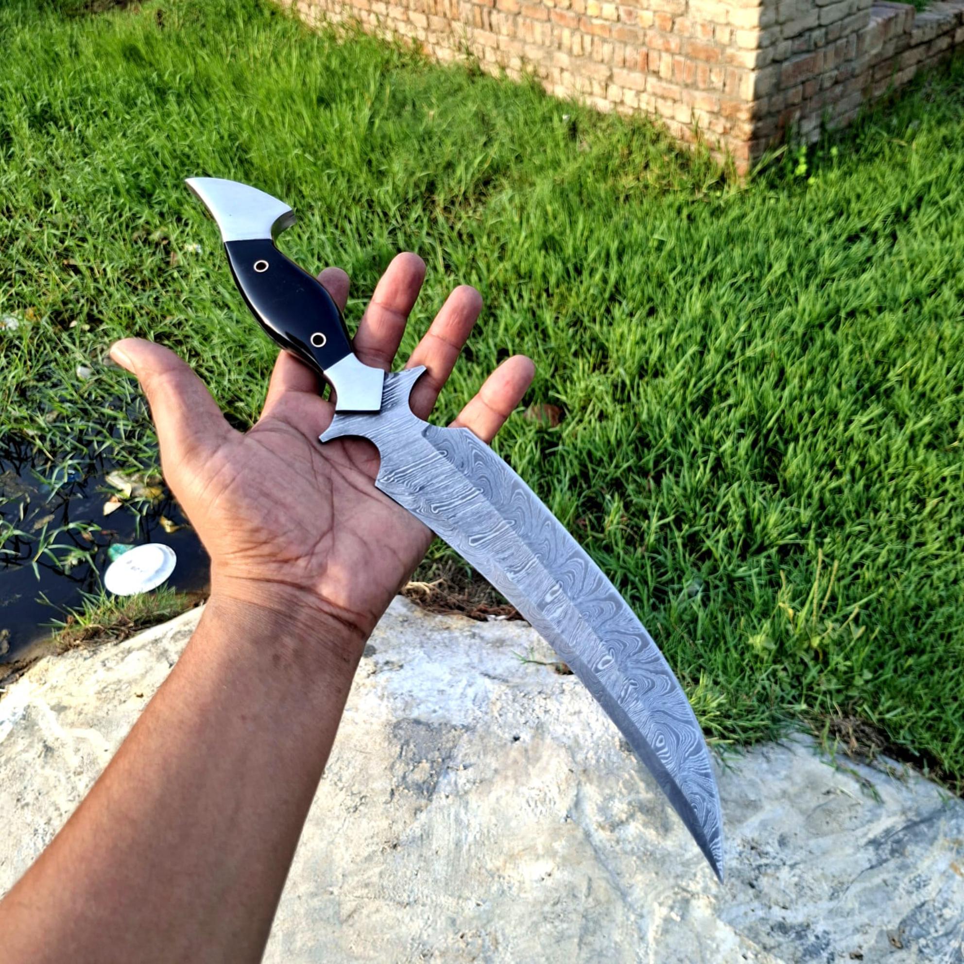 Hooked Guard Skinner Dagger with Black Handle and Long Patterned Blade
